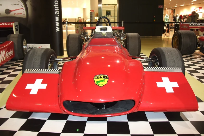 the very rare race car sits inside a building