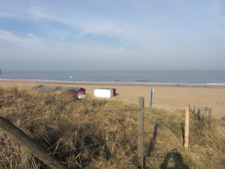 a fenced in area that looks to be empty at the beach