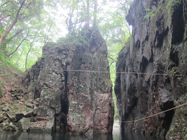 an open stream cuts between two rock formations