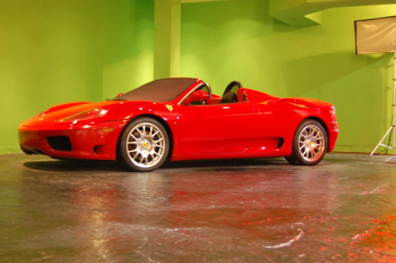 a red sports car parked in a building