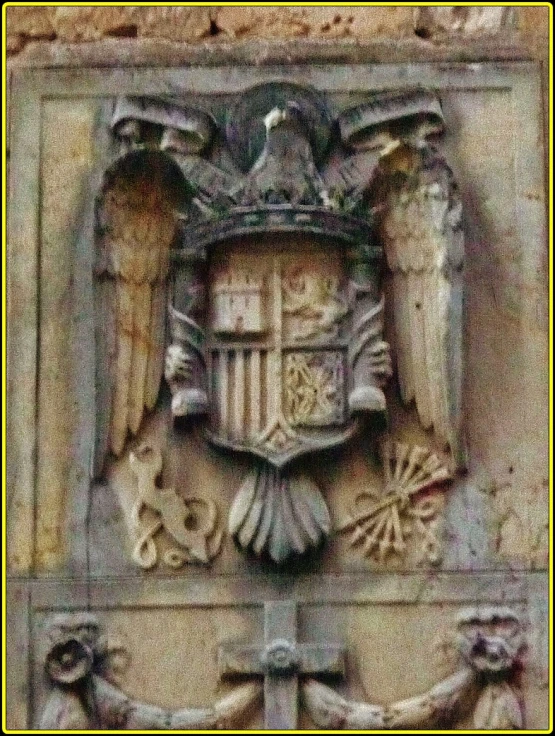 a large stone object on the side of a building