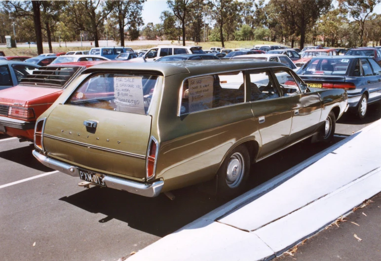 the cars are parked in an open parking lot