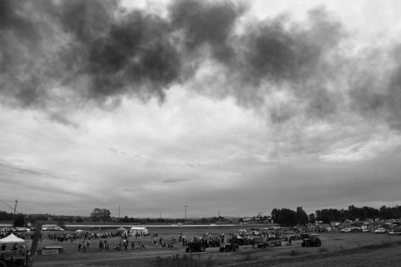 a black and white po of people standing in a field