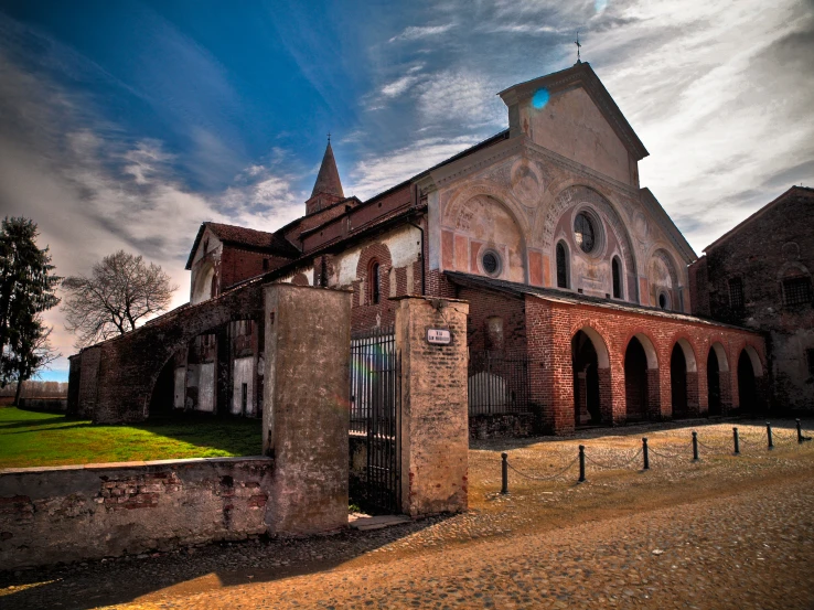 an old building with gate on the outside of it