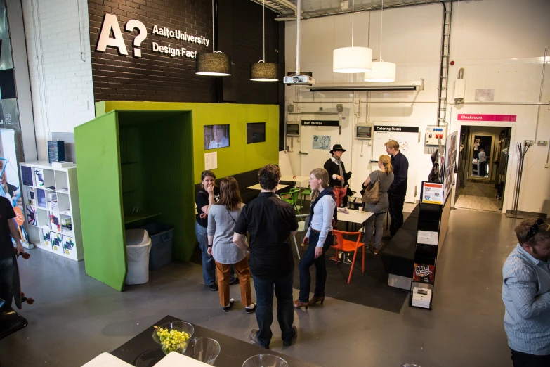 people in front of a booth at a retail event