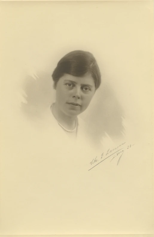 old picture of a woman with short hair in an oval frame