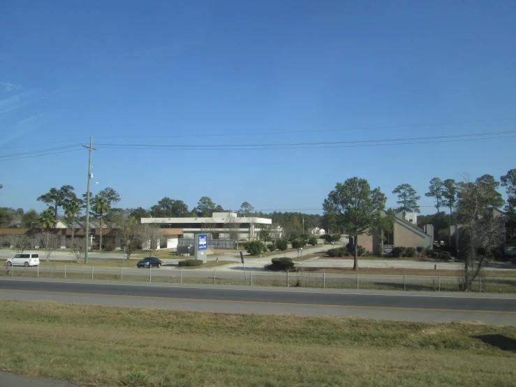 a highway with an intersection and a building behind it