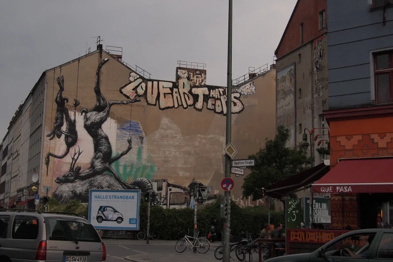 a building painted with graffiti with a mural