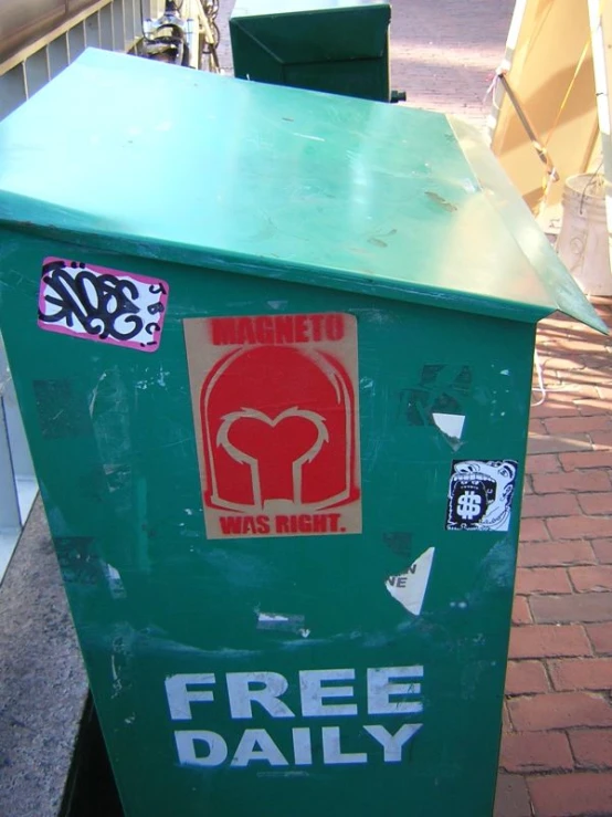 a po of some trash cans on the side of the road