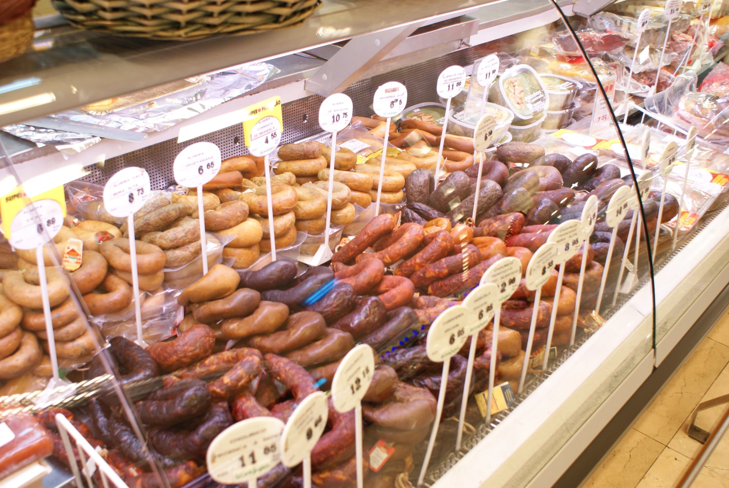 a close up of a display of different kinds of donuts