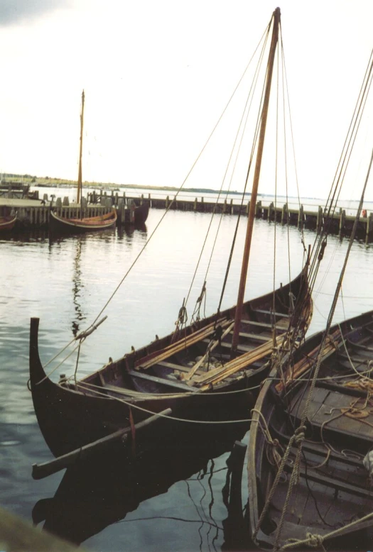 several boats docked in a pier on the water