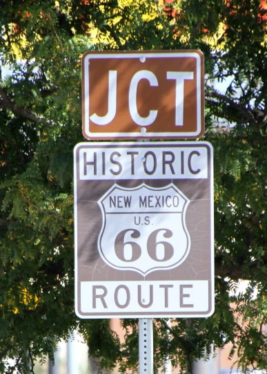 street sign displaying the route and highway to historic new mexico