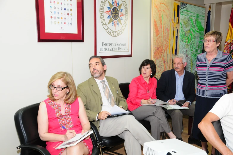 a group of people sitting in a waiting room