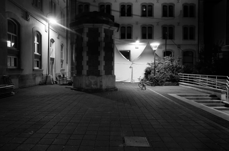 a courtyard in an old building at night