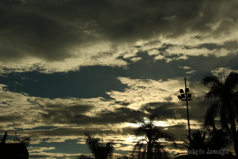 the sky is getting dark and stormy with clouds