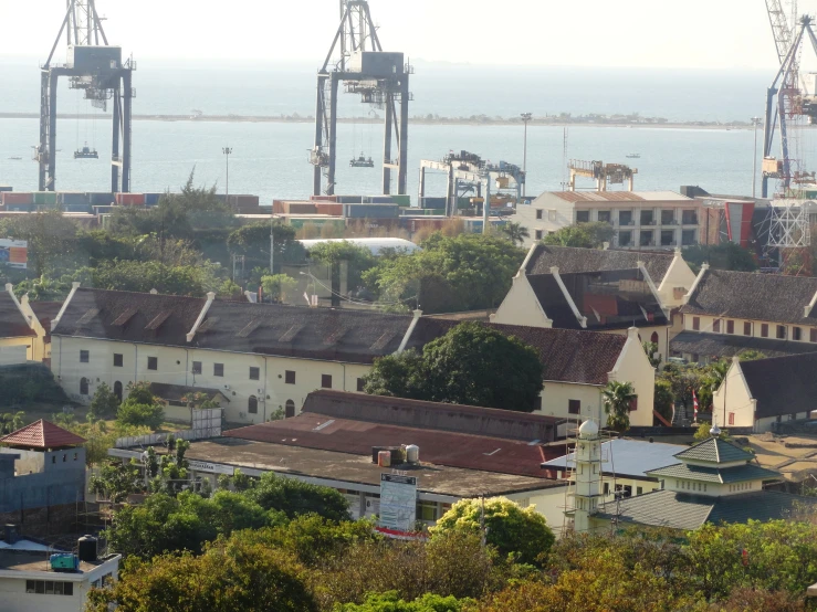 a lot of old buildings in front of the ocean