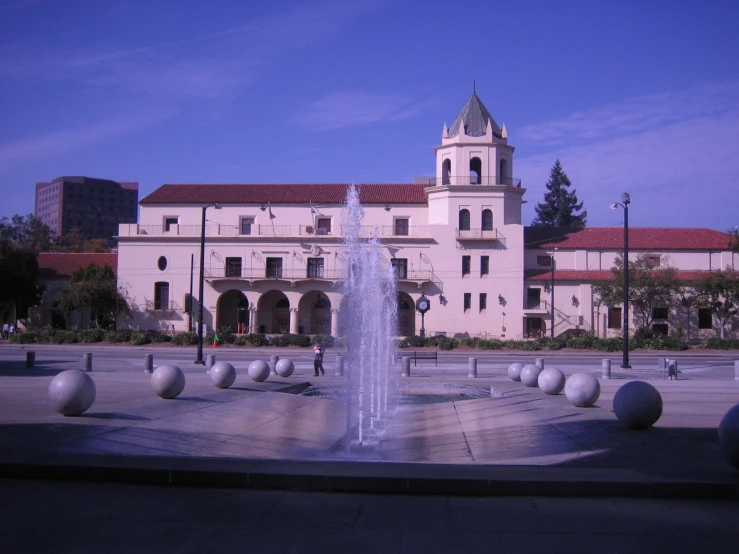 the building with the tower has red roofs