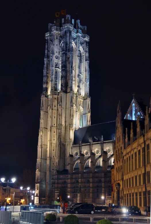 the tall building is lit up at night