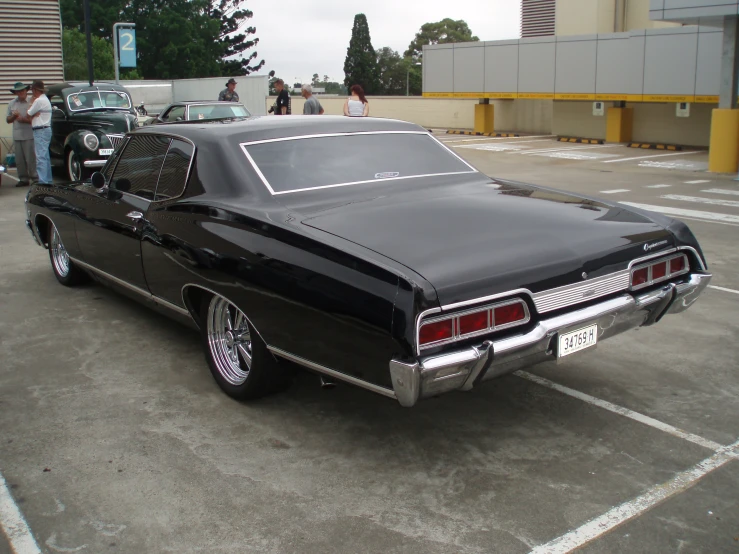 the car is parked next to others in the parking lot