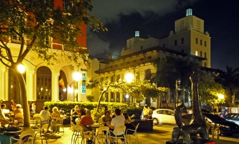 people are eating at an outdoor dining table