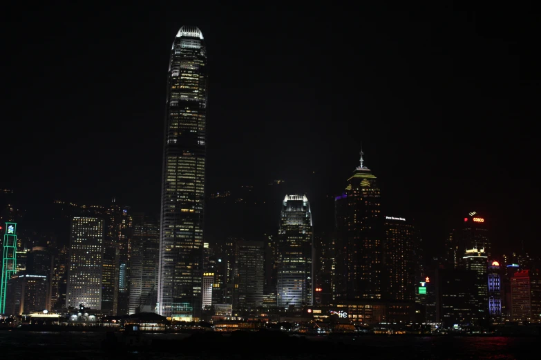 a tall building is lit up in the night