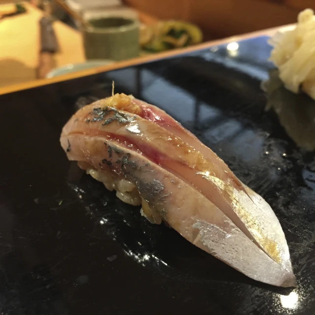 a sushi dish on a plate on a table
