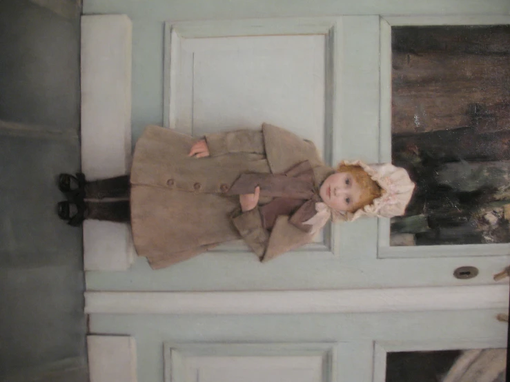 a young child standing in front of a door