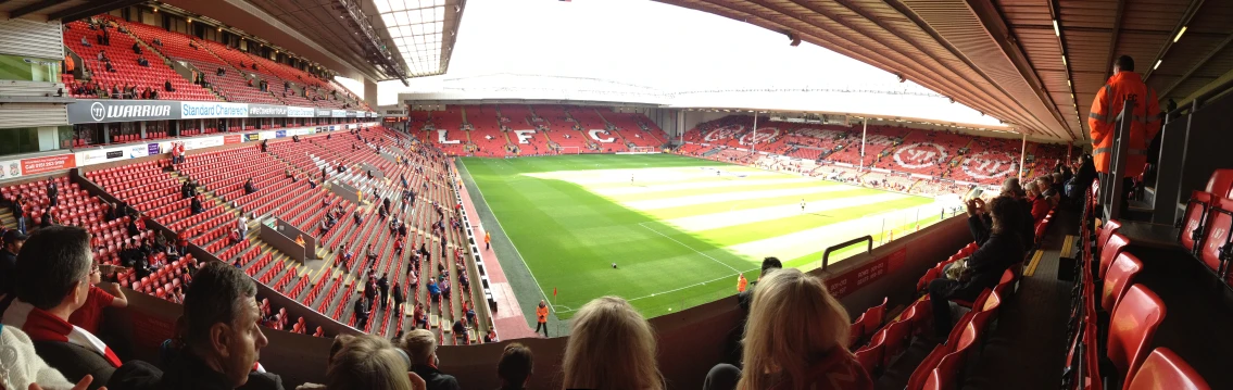 a large crowd of people watching a soccer game