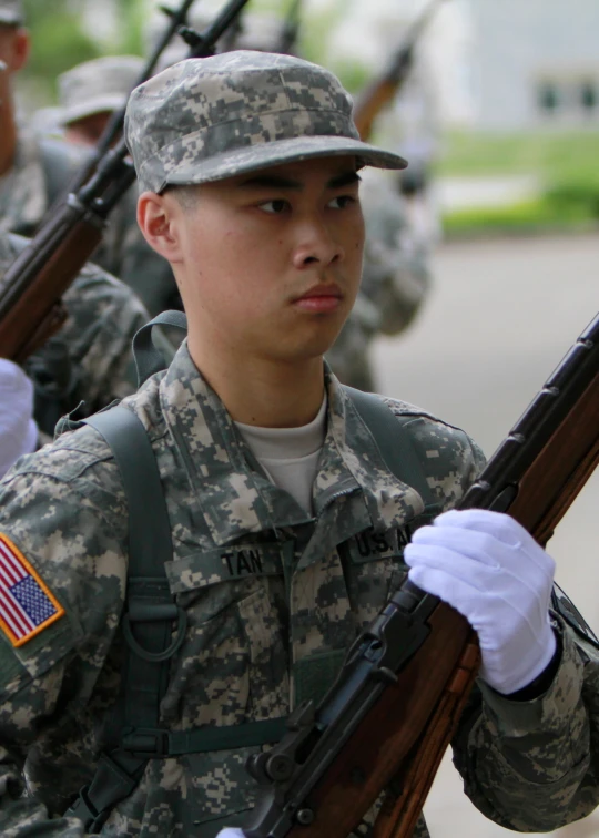 a group of soldiers wearing camouflage holding guns