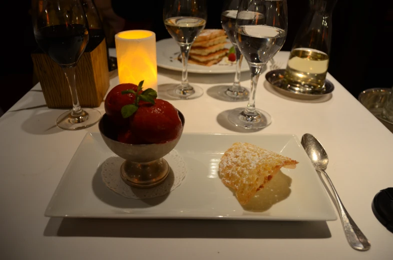 plates with dessert and wine on a table