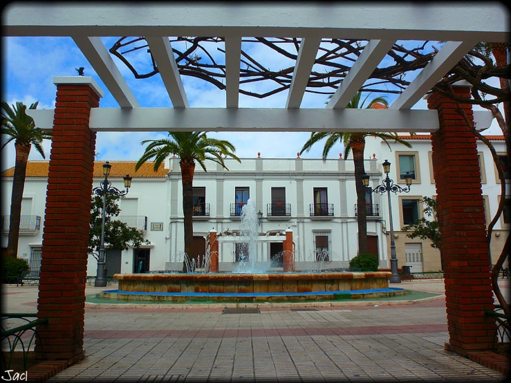 view from inside an archway in the middle of an empty square