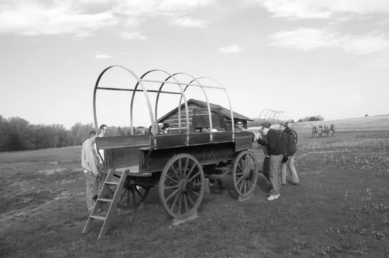 a man is standing next to a cart