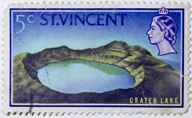 a stamp with a crater lake surrounded by trees