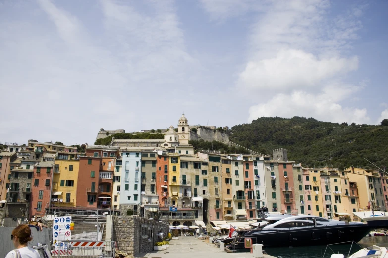 some houses buildings and a boat docked at a dock