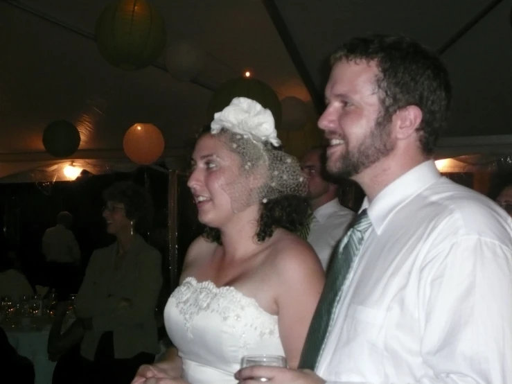 a woman in a wedding dress and a man wearing a suit