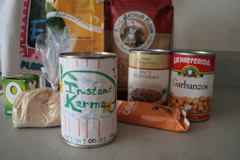 various items that include canned vegetables, beans and bread