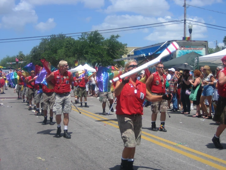 a group of people marching in a parade with flags