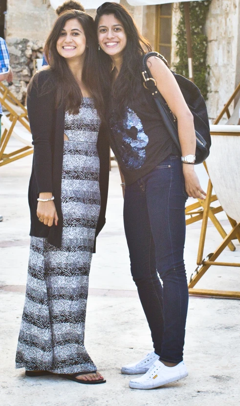 two women posing for a picture in their home