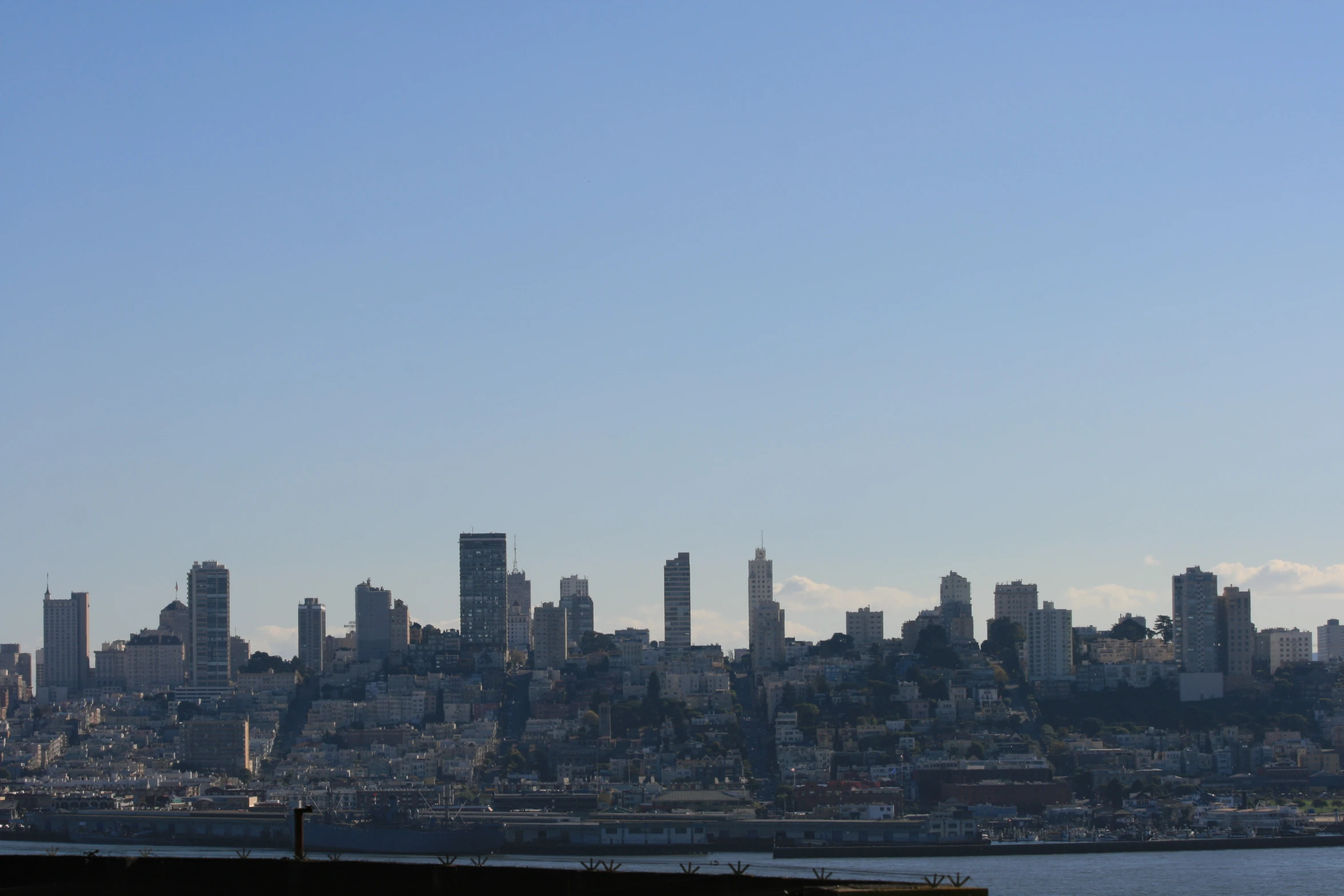 there are a few large buildings near the water