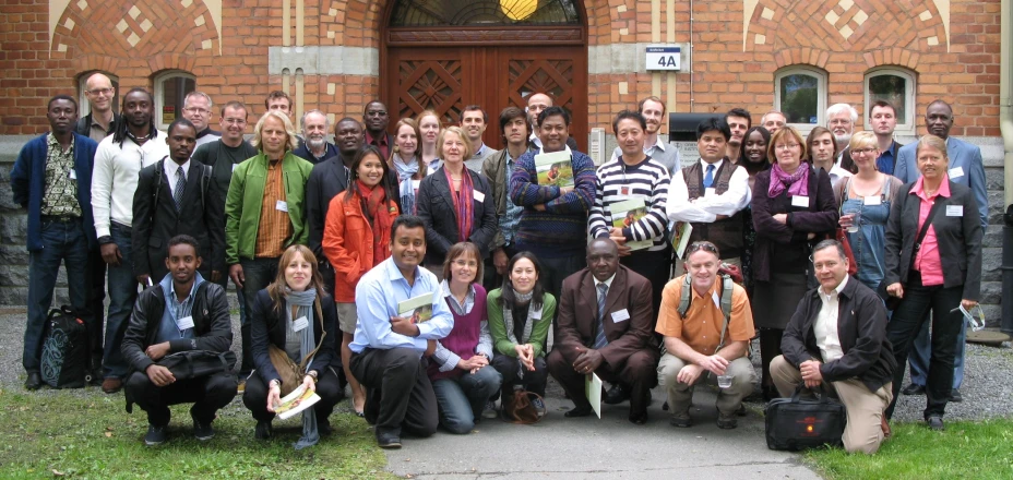 a group of people standing in front of a building