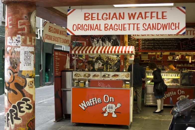 a food stand that is sitting on the side of a road