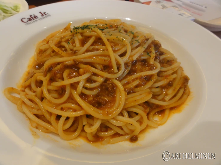 noodles on a white plate on a table