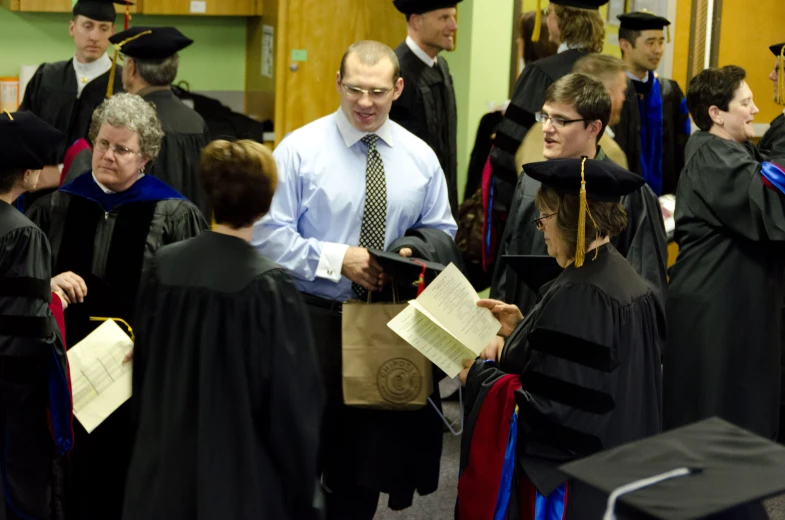 a group of people that are dressed in graduation robes