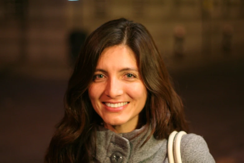 a lady with a smile on her face and long hair