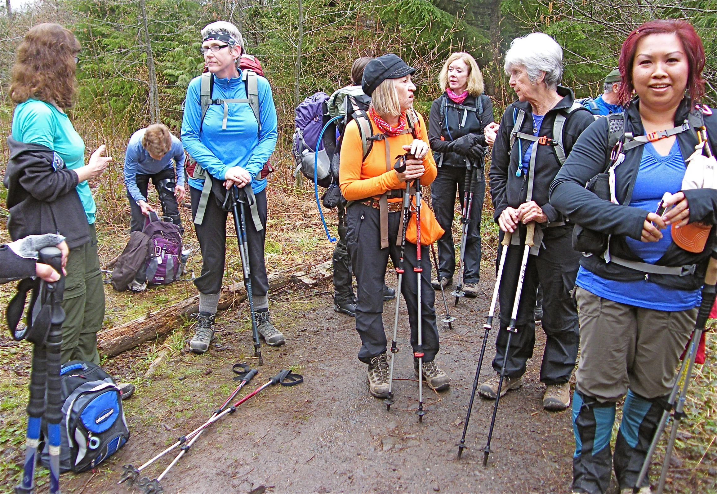 a group of women hikers in the woods together