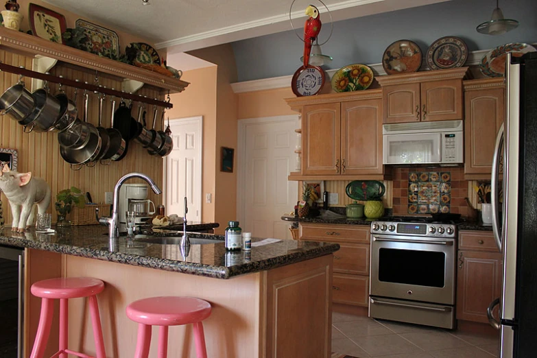 the counter is lined with colorful stools