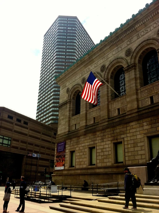 an american flag in front of a building