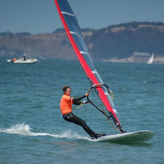 an image of a man windsurfing in the water