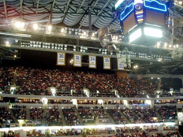 a large auditorium with two rows of people