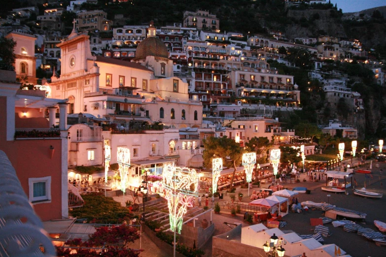 a city at night is lit up with christmas lights